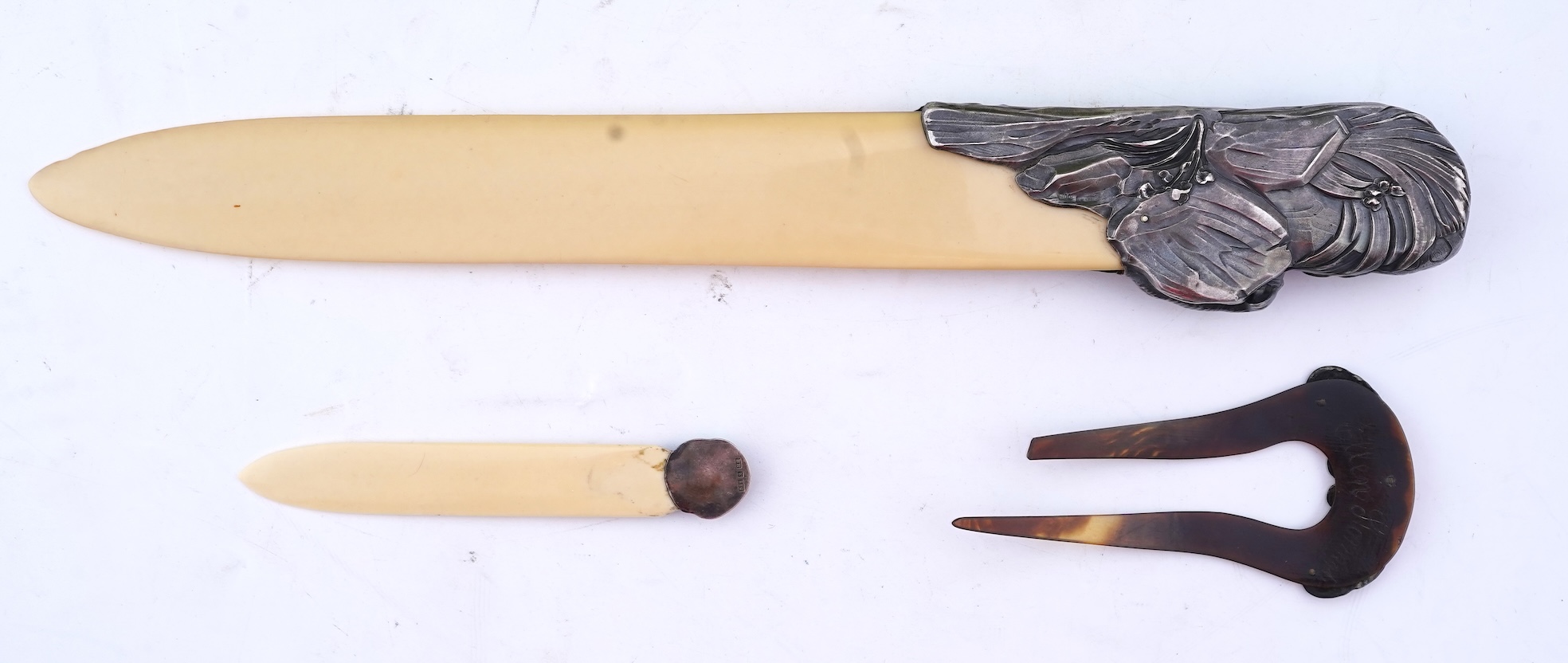 Two paper knives and a hair ornament, early 20th century